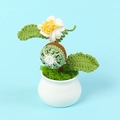Detailed view of a handmade crochet kiwi fruit potted plant in a white ceramic pot - Kiwi Fruit Potted Plant-White Pot