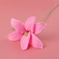 Handmade crochet pink lily flower with detailed yarn texture and green stem - Bright Pink