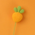 Detail of a handmade crochet carrot charm with orange yarn and green leaf accents - Carrot Flower Stem (No Leaf)