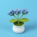 Detail of handmade crochet blue lily of the valley flowers in a white ceramic pot - Dark Blue