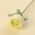 Macro detail of a handmade crochet bubble rose with precise petal stitch textures - Bubble Rose Stem / Gradient Green