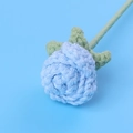 Macro view of a handmade crochet light blue rose showing intricate yarn textures - 3cm Flower Head / Blue