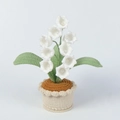 Handmade crochet lily of the valley potted plant with white bell flowers on grey background - White
