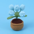 Macro shot of handcrafted crochet blue tulips in a knitted pot with detailed yarn texture - 5-Head Tulip Night Light Potted Plant / Blue