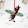 Aereo di Natale in ferro con pilota pupazzo di neve e decori a fiocchi, rosso e verde - Pilota Pupazzo di Neve