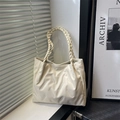 Cream white tote bag with quilted texture and braided handle in minimalist setting - Diagonal Pleated (6774) / No Pendant / Off White