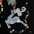 Clear acrylic reindeer ornament with silver glitter details on a Christmas tree branch - Flying Reindeer