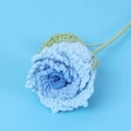 Macro view of blue gradient handmade crochet rose with textured yarn petals and green leaf - Luoshen Rose Stem / Gradient Blue