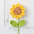 Handmade crochet sunflower with green leaves shown with scale ruler for size reference - Yellow Double Leaf Style