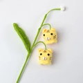 Handmade crochet tiger lily flower bouquet featuring cute yellow knitted animal heads - Lily of the Valley Tiger Style