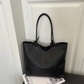 Handwoven black leather tote bag with signature intrecciato craft and knotted handles - Black