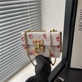 Vintage white chain crossbody bag with red cherry print and golden geometric lock - White