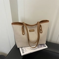 Bolso tote de lona minimalista con ribete de cuero marrón y remaches dorados de alta calidad - Marrón