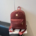Dark red leopard print backpack with gold hardware and textured velvet finish - Burgundy