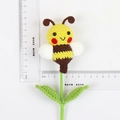Handmade crochet bee plush wand with yellow stripes and green leaves for bouquets - Bee Style