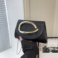 Minimalist black leather evening bag with a large gold buckle and fine chain strap - Black
