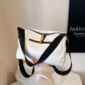 White nylon crossbody bag with black wide strap and orange zipper detail - White