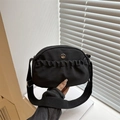 Black nylon crossbody bag with pleated front pocket and circular metal M logo detail - Black