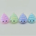 Detailed view of four colorful emoji poop squishy toys with foam beads filling inside - Colorful Macaron