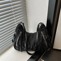 Modern black pleated crossbody bag with silver zippers and textured fabric for women - Black