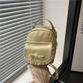 Mini Rucksack in Cremegelb aus PU-Leder mit Schleifendekor und weißer Spitze - Gelb