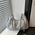 Metallic silver hobo shoulder bag with crumpled texture and fringe tassel zippers - Silver