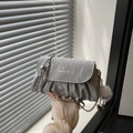 Silver metallic pleated crossbody bag with chain strap and plush keychain charm - Silver With Pendant