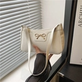 Chic cream white bow shoulder bag in glossy patent leather finish with gold hardware - White