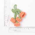 Handmade crochet orange blossom keychain with green leaves and size measuring scale - Quad Orange Pink Lily Of The Valley