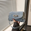 Blue denim crossbody bag with silver buckle and metal rivet details for women - Blue