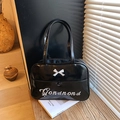 Black patent leather shoulder bag featuring a white 3D bow and elegant embroidery - Black