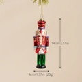 Nutcracker glass ornament for Christmas tree with glossy red and green hand-painted finish - Nutcracker Soldier