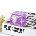 Glittery purple ice cube squishy toy with gold sparkles for stress relief and sensory play - Purple