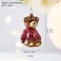 Christmas teddy bear glass ornament in red sweater with reindeer pattern and size labels - Bear