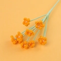 Macro detail of hand-crocheted orange flowers with pearl centers and green yarn stems - 9-Head Pearl Gypsophila Bouquet / Orange