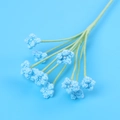 Detail of crochet baby's breath flower with blue wool petals and pearl centers - Blue