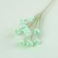 Detailed view of handmade crochet flowers with small pearls on green stems - Green
