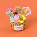 Macro detail of handmade crochet flower basket with colorful knitted flora and label - Pink Flowers Calla Lily (Crochet Small Flower Basket)