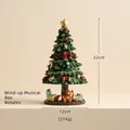 Green Christmas tree music box with bear base, 22cm rotating resin festive ornament - Rotating Christmas Tree Music Box