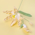 Detailed close-up of handmade crochet daylily with yellow cotton petals and green stem - Yellow