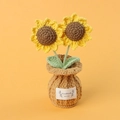 Macro detail of hand-knitted sunflower crochet plant with Handmade With Love label - Sunflower Brown Vase