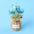 Detailed texture of handmade crochet blue orchids with HandMade WITH LOVE label - Gradient Blue-Rose Brown Vase