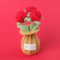 Macro detail of hand-crocheted red rose bonsai in a knit pot with handmade label - Red-Rose Brown Vase