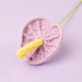 Handmade knitted purple anthurium flower with yellow spadix on a matching lilac background - Purple