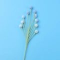 Detail of handcrafted crochet blue flowers with soft yarn texture for home decoration - Berry Branch / Gradient Blue