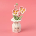 Handmade crochet orchid potted plant with pink petals and white handmade label - Pink Butterfly Orchid in White Vase