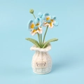 Handmade crochet pansy flower pot with blue and white petals in a small woven vase - Blue Butterfly Orchid in White Vase