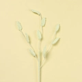 Detailed macro view of handmade crochet green leaf sprig with knitted texture for decor - Light Yellow