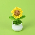 Handmade crochet sunflower in a white ceramic pot with vibrant yellow petals and green leaves - Sunflower Pot