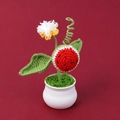 Detail of a handmade crochet watermelon plant in a ceramic pot with green leaves - Sunflower Potted (Bean Green Leaf)